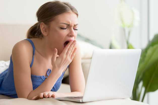 tired woman yawning after too long work laptop 1163 3825